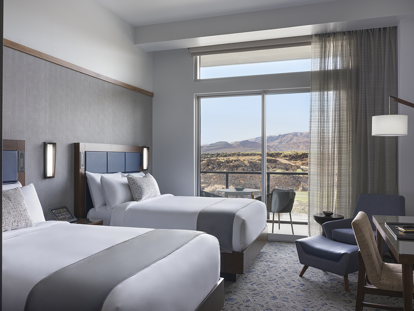 Twin-bed hotel room for tourists visiting Snow Canyon.