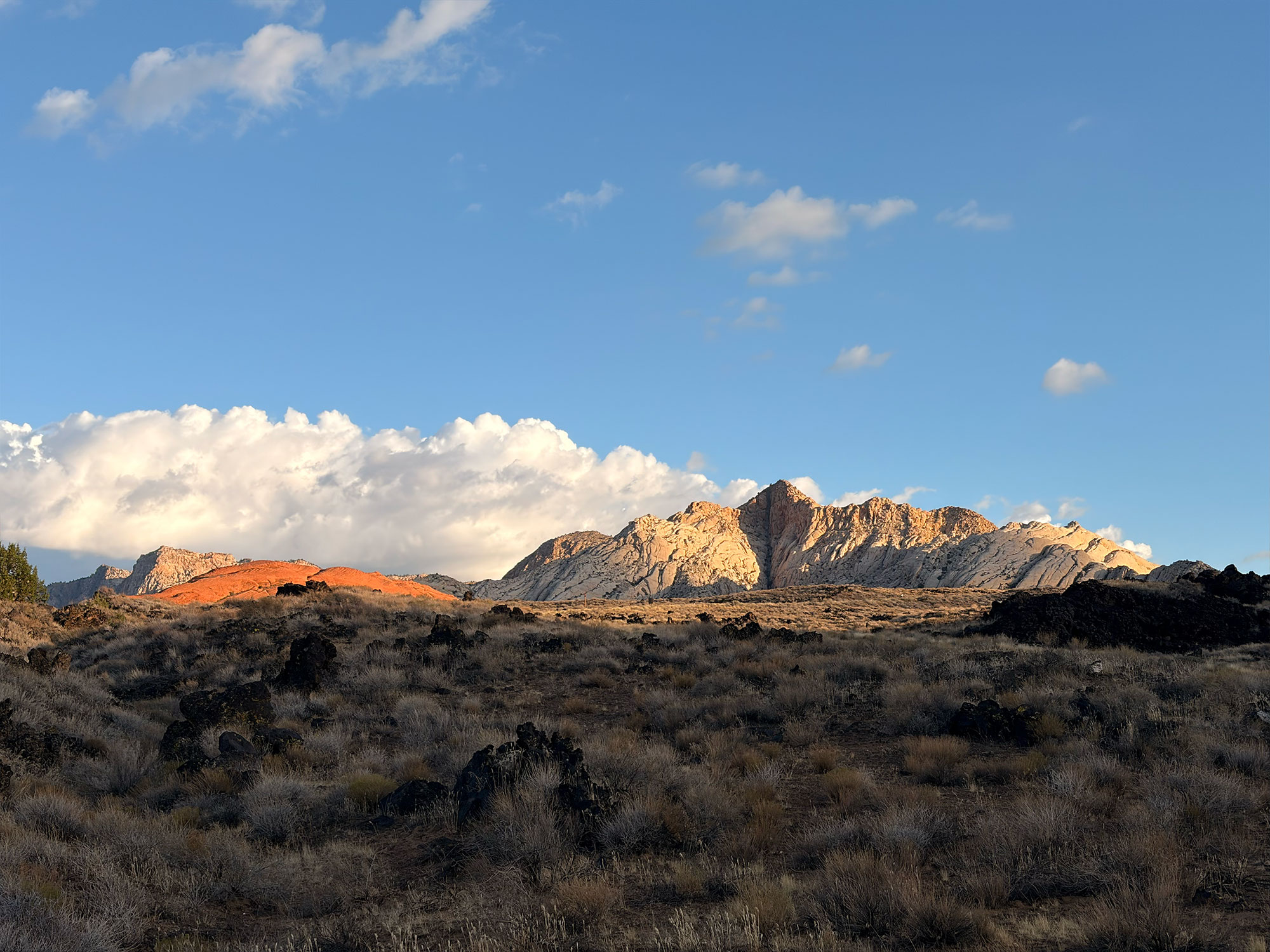 Black lava flows beneath the red and white sandstone of Snow Canyon State Park